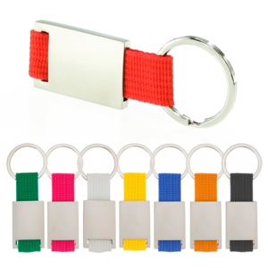 9274, Llavero de divertido diseño con cinta de poliéster de variados y vivos colores. Con cuerpo metálico especialmente diseñado para marcaje en láser.